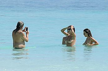 Busty Emily Ratajkowski topless on a beach in Cancun