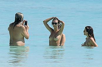 Busty Emily Ratajkowski topless on a beach in Cancun