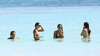 Busty Emily Ratajkowski topless on a beach in Cancun