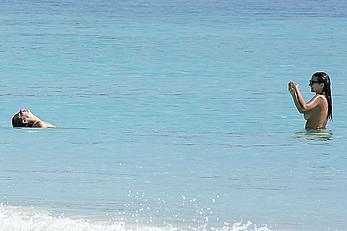 Busty Emily Ratajkowski topless on a beach in Cancun