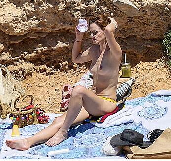 Emma Watson topless on a beach in Ibiza paparazzi shots - June 16, 2022