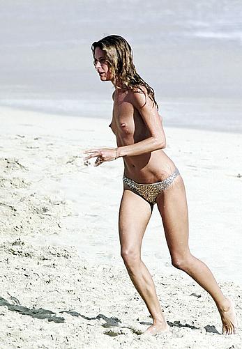 Erin Wasson topless on a beach