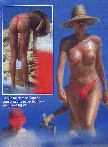 Esther Arroyo topless in red bikini pants on a beach