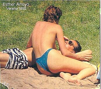 Spanish actress Esther Arroyo sunbathing topless on a beach