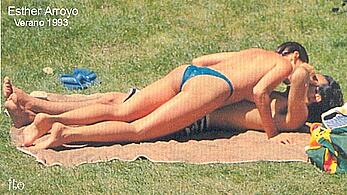 Spanish actress Esther Arroyo sunbathing topless on a beach