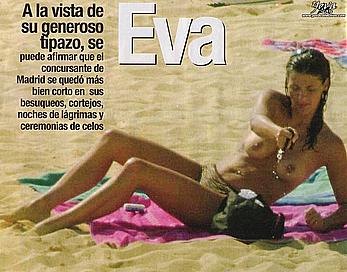 Eva Paz sunbathing topless on a beach