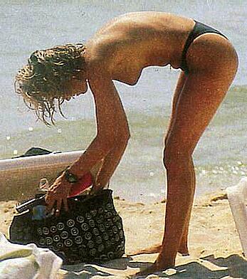 Federica Panicucci topless on a beach paparazzi shots