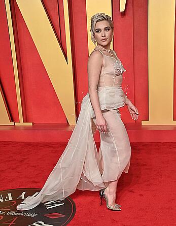 Florence Pugh braless in see through top at the Vanity Fair Oscar Party