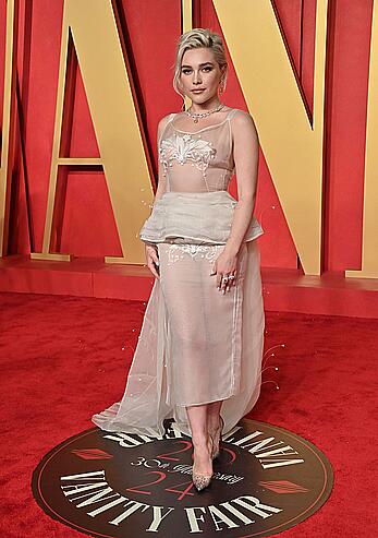 Florence Pugh braless in see through top at the Vanity Fair Oscar Party