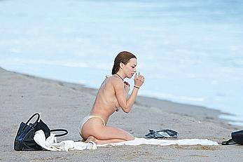 Francesca Eastwood topless on the beach in Malibu