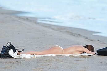 Francesca Eastwood topless on the beach in Malibu