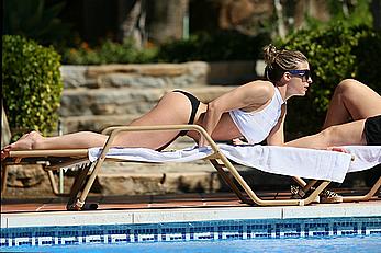 Gemma Atkinson bottom of boob in bikini poolside in Marbella