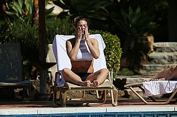 Gemma Atkinson bottom of boob in bikini poolside in Marbella