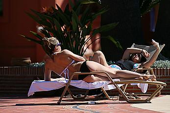 Gemma Atkinson bottom of boob in bikini poolside in Marbella