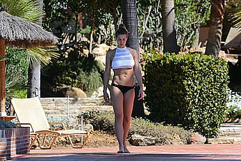 Gemma Atkinson bottom of boob in bikini poolside in Marbella