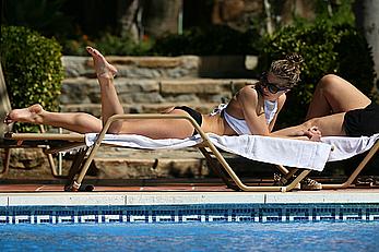 Gemma Atkinson bottom of boob in bikini poolside in Marbella