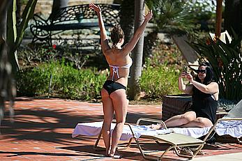 Gemma Atkinson bottom of boob in bikini poolside in Marbella