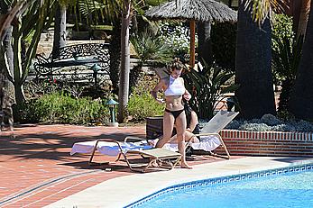 Gemma Atkinson bottom of boob in bikini poolside in Marbella