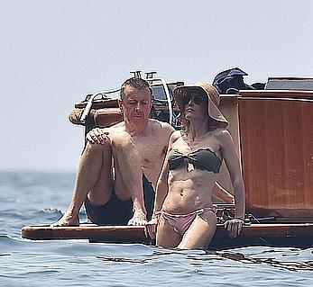 Gillian Anderson flashes her tit and ass crack while removing her bikini on holiday in Italy