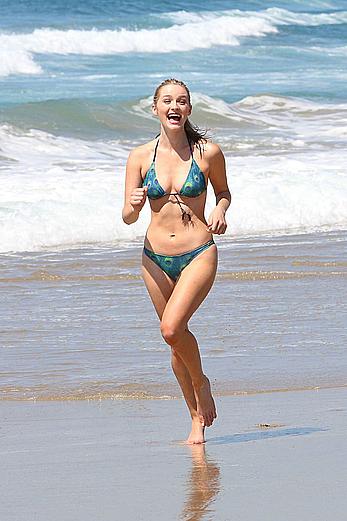 Greer Grammer wearing a bikini on a beach