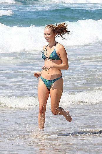 Greer Grammer wearing a bikini on a beach