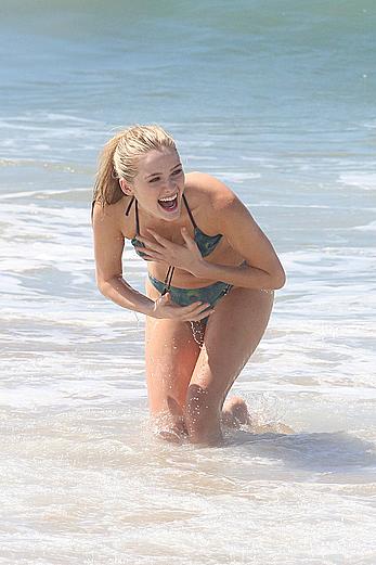 Greer Grammer wearing a bikini on a beach