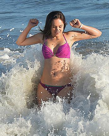 Hayley Orrantia in pink bikini candids