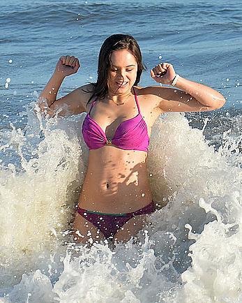 Hayley Orrantia in pink bikini candids