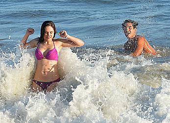 Hayley Orrantia in pink bikini candids