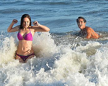 Hayley Orrantia in pink bikini candids