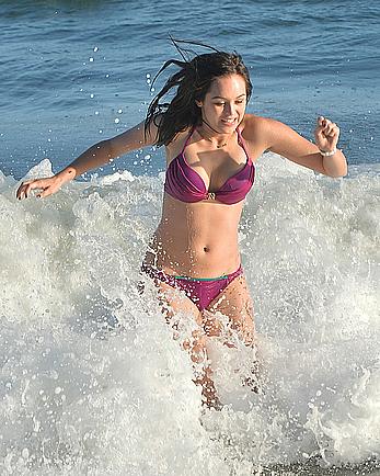 Hayley Orrantia in pink bikini candids