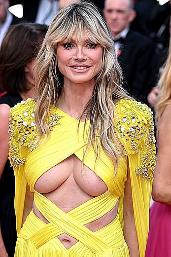 Heidi Klum areola slip and long sexy legs at La Passion De Dodin Bouffant Cannes red carpet