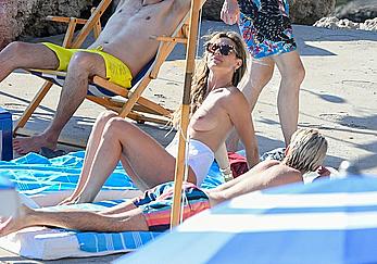 Heidi Klum sunbathing topless in Capri