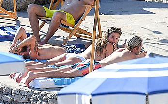 Heidi Klum sunbathing topless in Capri