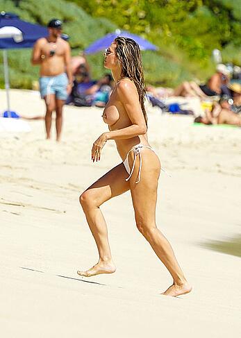 Heidi Klum topless on the beach in St. Barts