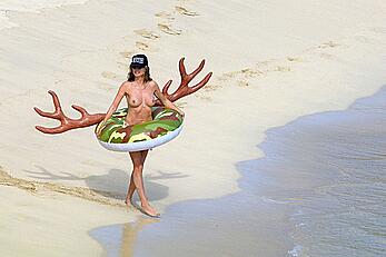 Heidi Klum topless on the beach in St. Barts