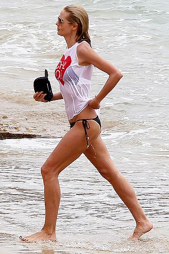 Heidi Klum in wet shirt on the beach in St.Barths