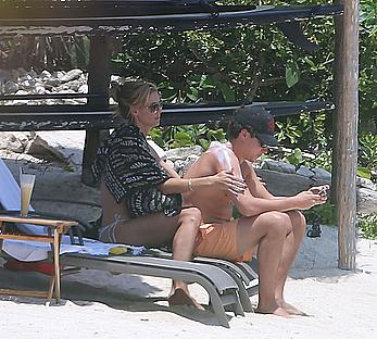 Heidi Klum caught topless on a beach in Mexico