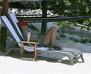 Heidi Klum caught topless on a beach in Mexico