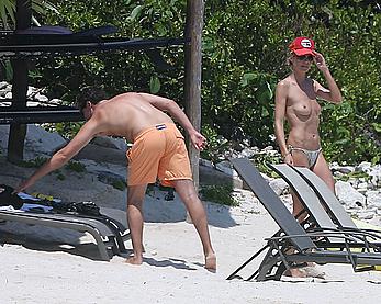 Heidi Klum caught topless on a beach in Mexico