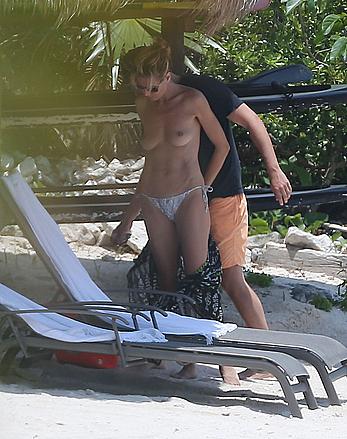 Heidi Klum caught topless on a beach in Mexico