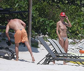 Heidi Klum caught topless on a beach in Mexico