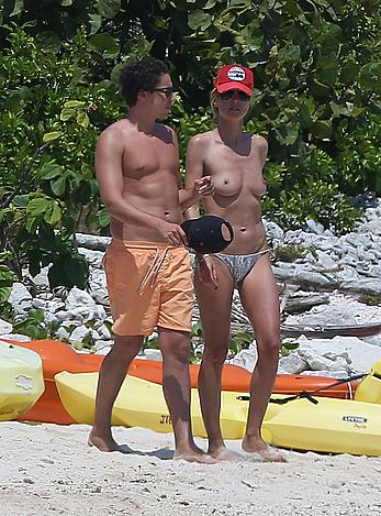 Heidi Klum caught topless on a beach in Mexico