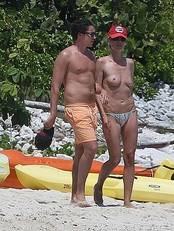 Heidi Klum caught topless on a beach in Mexico