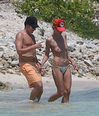 Heidi Klum caught topless on a beach in Mexico