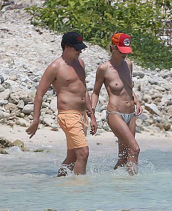 Heidi Klum caught topless on a beach in Mexico