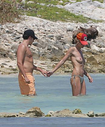 Heidi Klum caught topless on a beach in Mexico