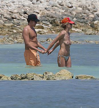 Heidi Klum caught topless on a beach in Mexico