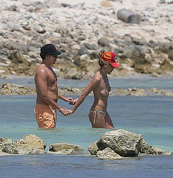 Heidi Klum caught topless on a beach in Mexico