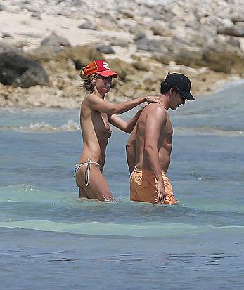 Heidi Klum caught topless on a beach in Mexico